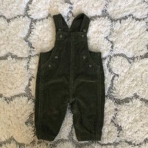 Caters forest green overalls.
